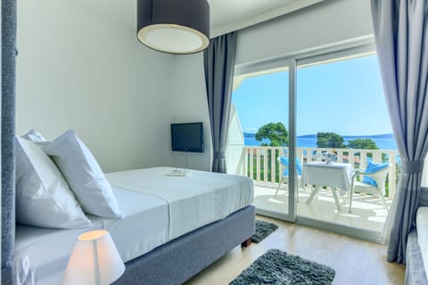 Deluxe Double or Twin Room, Terrace, Sea View | Minibar, in-room safe, desk, blackout drapes