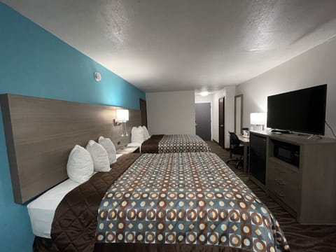 Blackout drapes, iron/ironing board, free cribs/infant beds