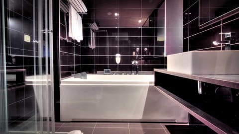 Suite, Jetted Tub | Bathroom | Free toiletries, hair dryer, towels, soap