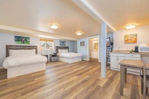 Family Room, 2 Queen Beds | Iron/ironing board, free WiFi, bed sheets