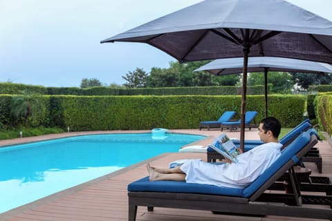 Outdoor pool, pool umbrellas, sun loungers