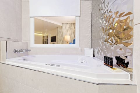 Shower, designer toiletries, hair dryer, towels