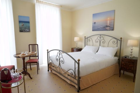 Deluxe Double Room, Balcony, City View | Minibar, in-room safe, individually decorated, individually furnished