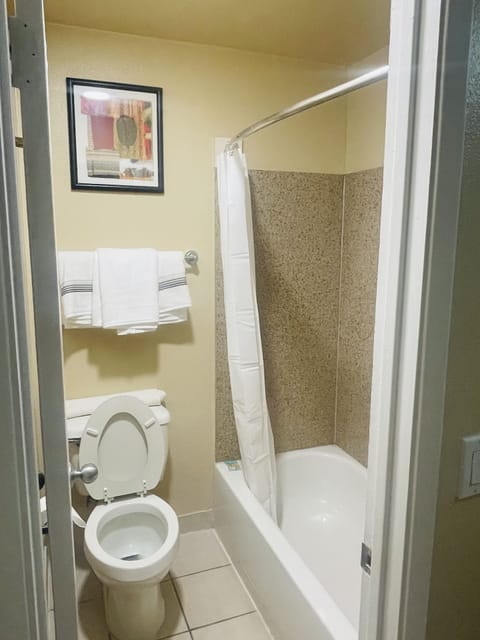 Combined shower/tub, hair dryer, towels, soap