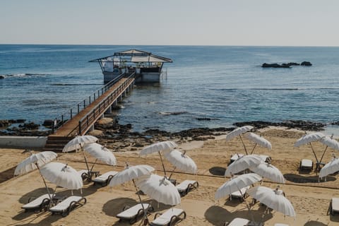 Private beach, white sand, free beach cabanas, sun loungers
