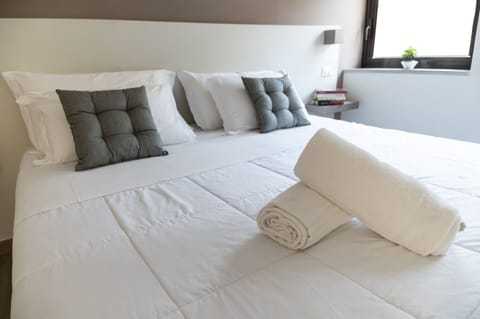 Premium bedding, down comforters, memory foam beds, minibar