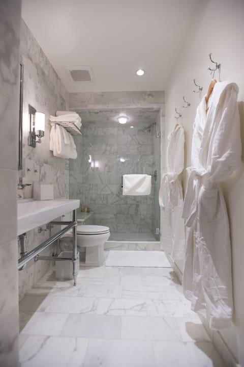 Combined shower/tub, designer toiletries, hair dryer, bathrobes