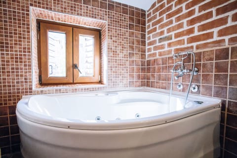 Family Suite, Terrace | Bathroom amenities | Combined shower/tub, designer toiletries, hair dryer, bathrobes