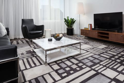 Executive Suite, 1 King Bed | Living area | 46-inch flat-screen TV with cable channels, TV, iPod dock