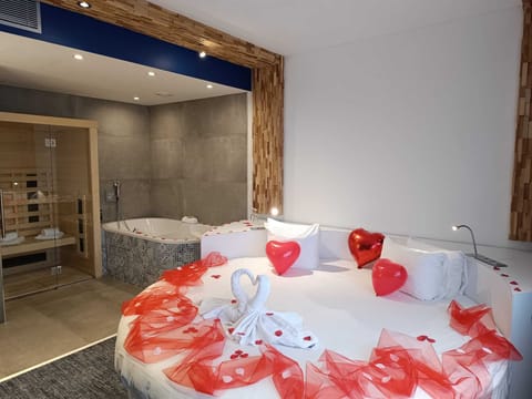Suite, Multiple Beds | Bathroom | Eco-friendly toiletries, hair dryer, towels, soap