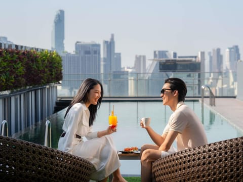 Outdoor pool, open 7:00 AM to 10:00 PM, pool umbrellas, sun loungers
