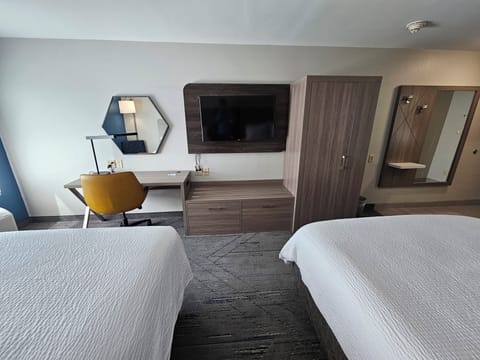 Premium bedding, down comforters, pillowtop beds, in-room safe