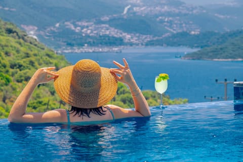 Outdoor pool, open noon to 6:00 PM, pool umbrellas, sun loungers