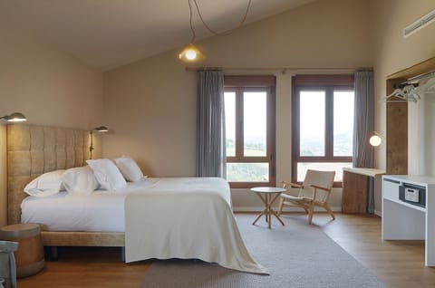 Junior Suite | Down comforters, minibar, in-room safe, individually decorated