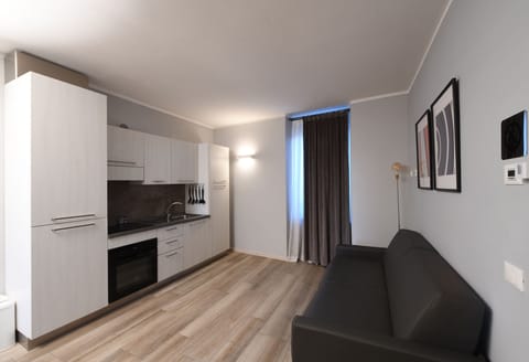 Apartment (6 Adults Apt 24) | Living area | 32-inch flat-screen TV with cable channels, TV
