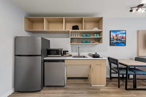 Full-size fridge, microwave, stovetop, dining tables