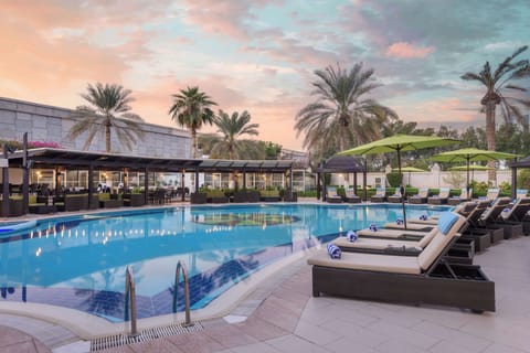 Outdoor pool, pool umbrellas, sun loungers