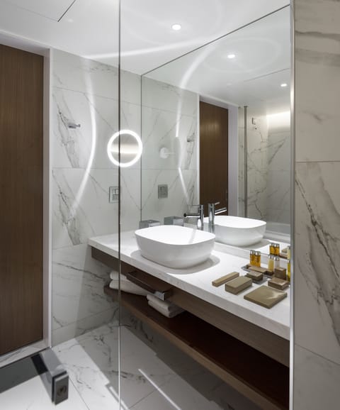 Presidential Suite | Bathroom | Rainfall showerhead, hair dryer, bathrobes, slippers