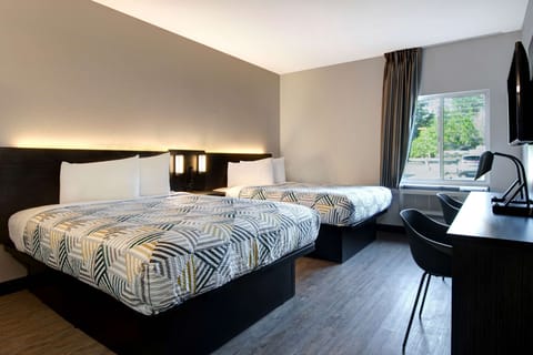 Desk, laptop workspace, blackout drapes, iron/ironing board