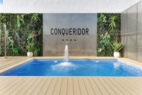 Seasonal outdoor pool, open 11:00 AM to 9:00 PM, pool umbrellas