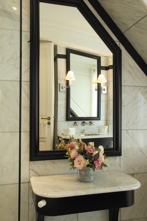 Designer toiletries, hair dryer, bathrobes, slippers