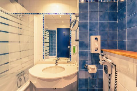 Bathtub, eco-friendly toiletries, hair dryer, towels