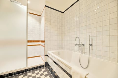 Designer toiletries, hair dryer, bathrobes, slippers