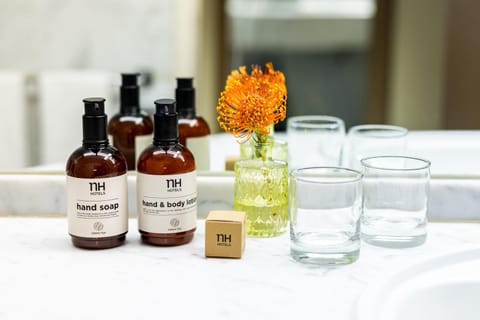 Deep soaking tub, rainfall showerhead, eco-friendly toiletries