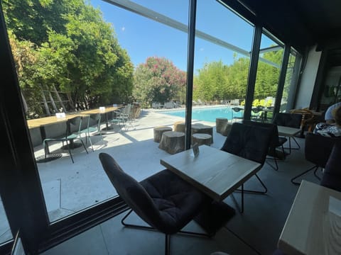 Breakfast, lunch, dinner served; pool views