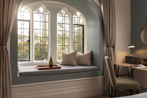 Executive Suite, 1 Bedroom | Individually decorated, desk, iron/ironing board, free WiFi