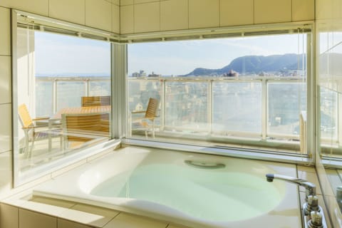 Separate tub and shower, free toiletries, hair dryer, slippers