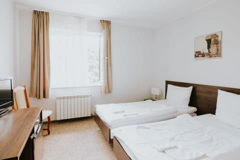 Twin Room | Living area | Flat-screen TV