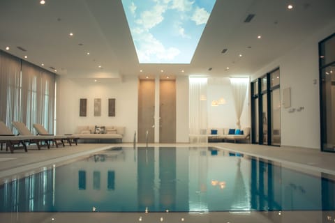 Indoor pool, outdoor pool, pool umbrellas, sun loungers