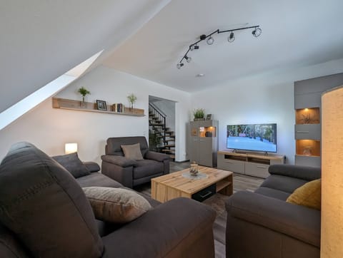 Apartment | Living area | 25-inch LED TV with cable channels, DVD player