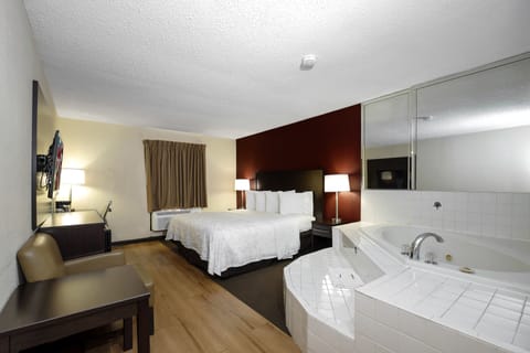 Premium bedding, desk, laptop workspace, blackout drapes