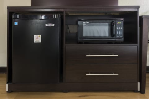 Premium bedding, desk, laptop workspace, blackout drapes