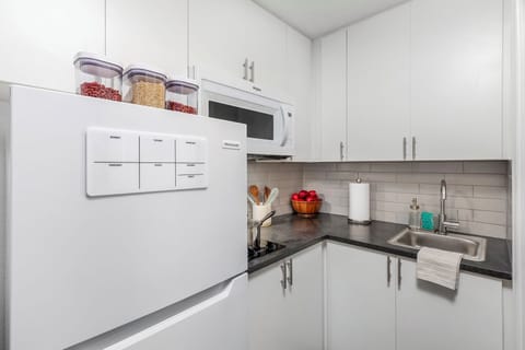 Premium Room, 1 Queen Bed | Private kitchen | Dining tables