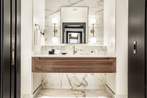 Designer toiletries, hair dryer, bathrobes, slippers