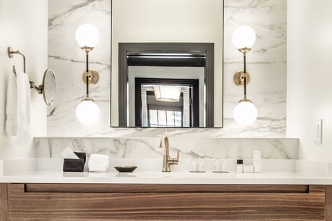 Designer toiletries, hair dryer, bathrobes, slippers