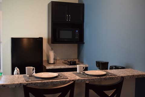 Standard Room, 1 King Bed | Private kitchen | Full-size fridge, microwave, coffee/tea maker, cookware/dishes/utensils