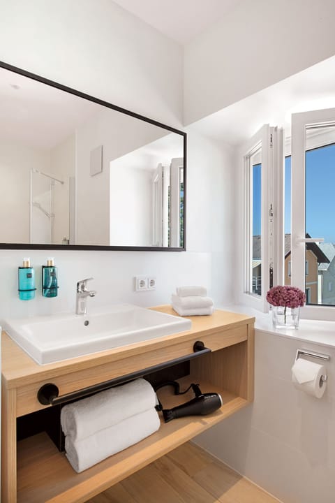 Designer toiletries, hair dryer, towels, soap