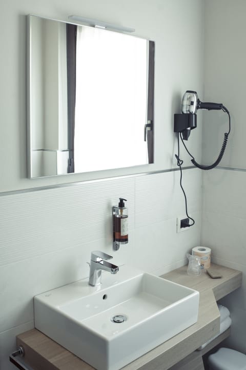 Bathtub, hair dryer, bathrobes, slippers