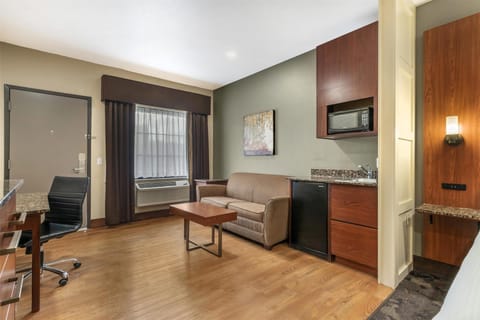 Desk, laptop workspace, blackout drapes, iron/ironing board