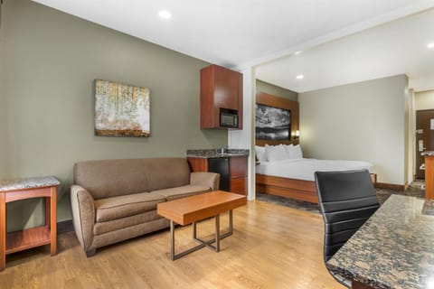 Desk, laptop workspace, blackout drapes, iron/ironing board