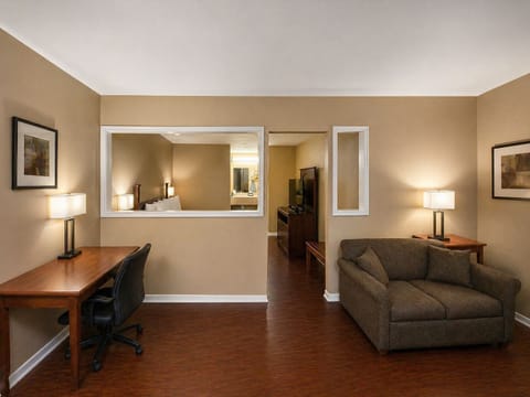 Suite, 1 King Bed, Non Smoking | Desk, laptop workspace, blackout drapes, soundproofing