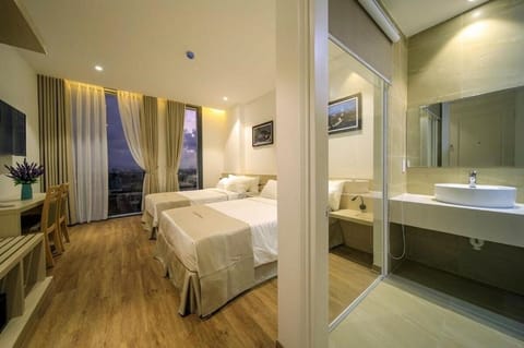 Luxury Triple Room | Minibar, in-room safe, desk, blackout drapes