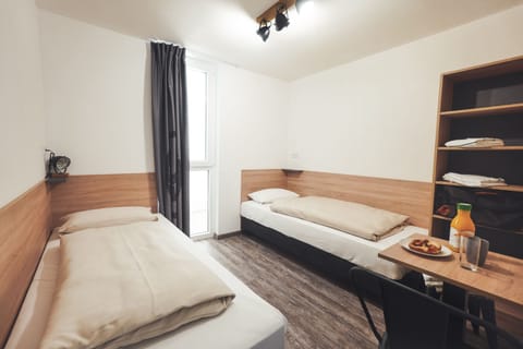 Hypo-allergenic bedding, blackout drapes, free WiFi, bed sheets