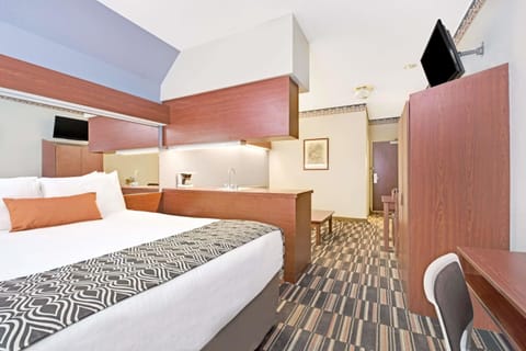 Desk, blackout drapes, iron/ironing board, cribs/infant beds