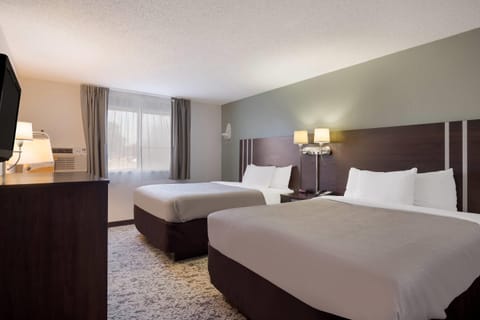 Down comforters, desk, iron/ironing board, free cribs/infant beds