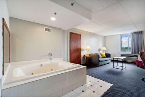Suite, Multiple Beds, Non Smoking | In-room safe, desk, laptop workspace, iron/ironing board